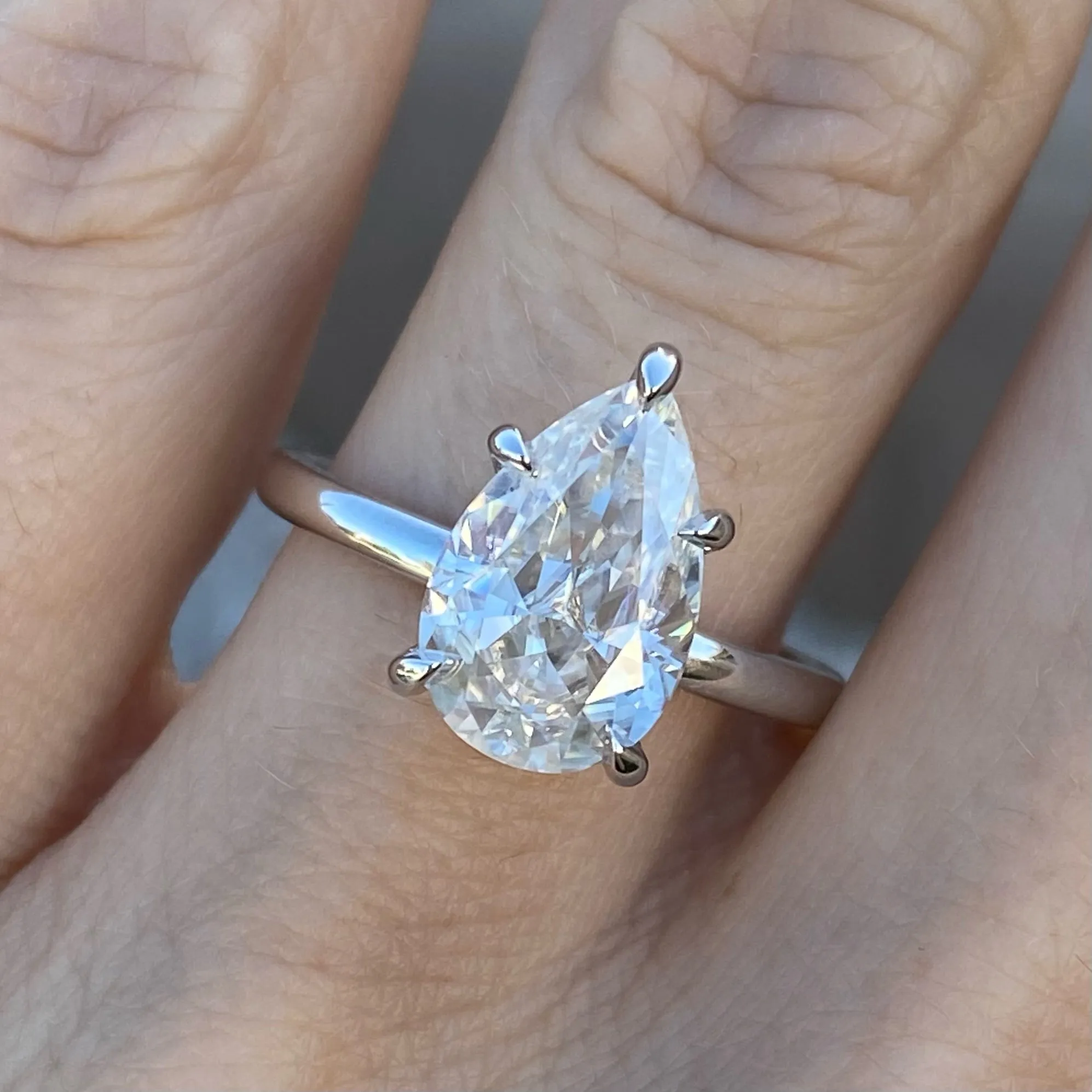 Olivia FLUSH (3.45ct) Pear Moissanite ( ) Hidden Halo
